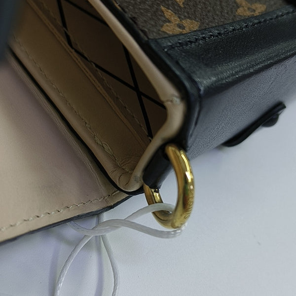 TRUNK Monogram Coated Canvas Brown