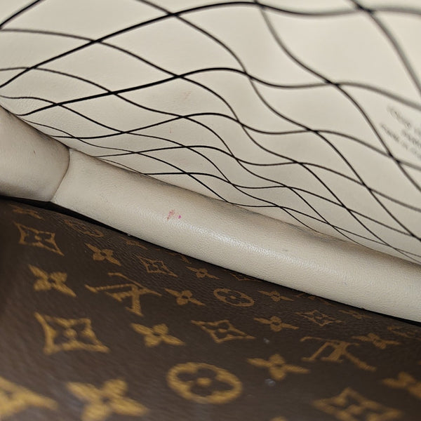 TRUNK Monogram Coated Canvas Brown
