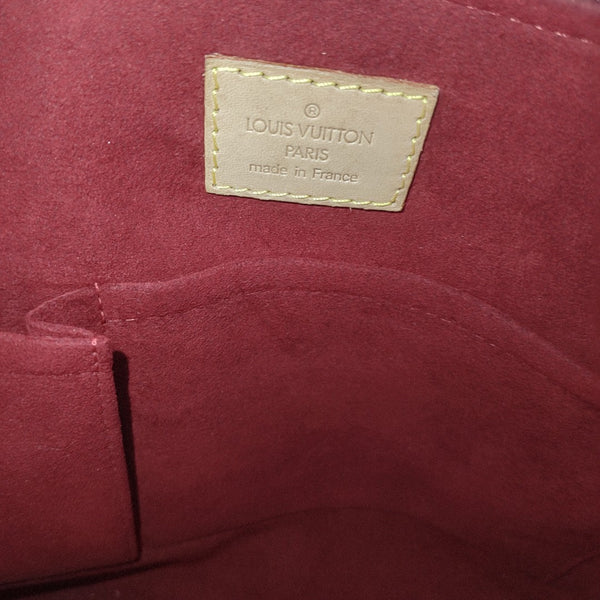 COUSSIN GM Monogram Coated Canvas Brown