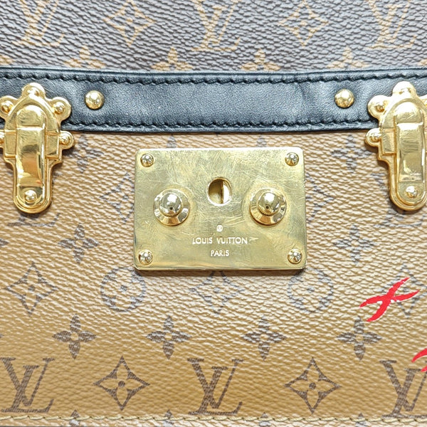 TRUNK Monogram Coated Canvas Brown