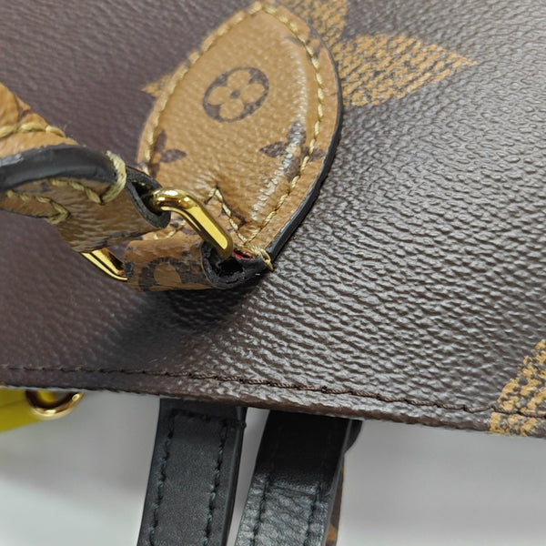 ONTHEGO MM Monogram Coated Canvas Brown