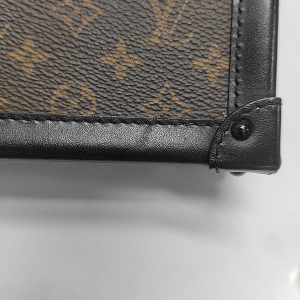 TRUNK Monogram Coated Canvas Brown