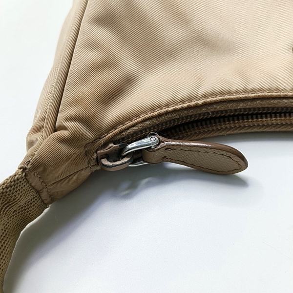 Authenticated pre-owned Re-edition2000 Mini Nylon Beige - Top Handle Bag at Looply
