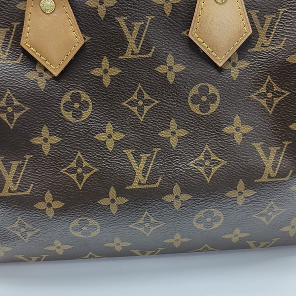 SPEEDY 25 Monogram Coated Canvas Brown