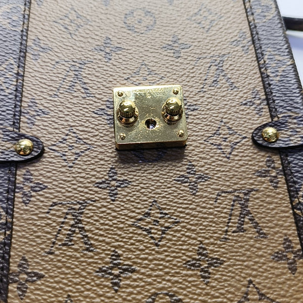 TRUNK Monogram Coated Canvas Brown