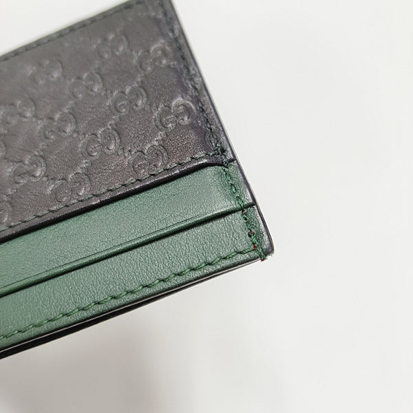 Authenticated pre-owned Microguccissima Monogram Calfskin Black Card Holder - Card Holder at Looply