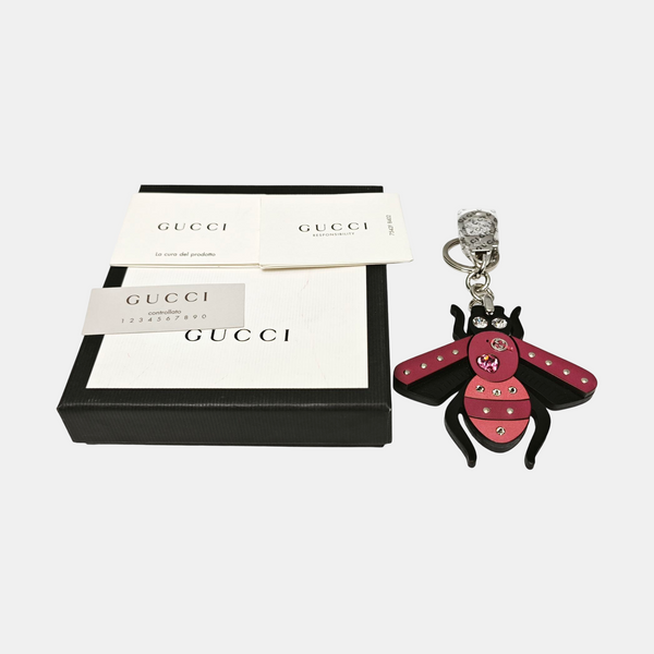 Authenticated pre-owned Black-tone Metal Bag Charm - Bag Charm at Looply