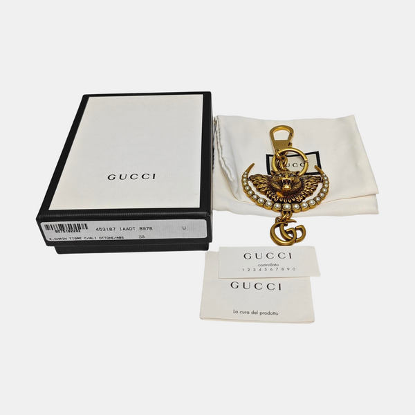 Authenticated pre-owned Gold-tone Metal Bag Charm - Bag Charm at Looply