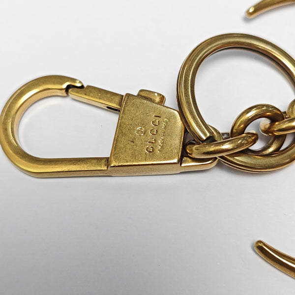 Authenticated pre-owned Gold-tone Metal Bag Charm - Bag Charm at Looply