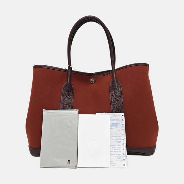 Authenticated pre-owned Garden Party Canvas Red - Top Handle Bag at Looply