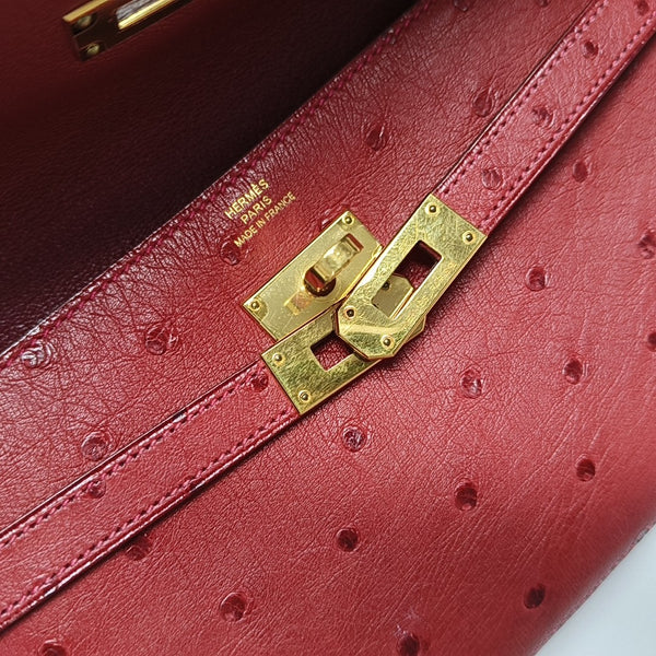 Authenticated pre-owned Kelly Ostrich Red Wallet - Wallet at Looply