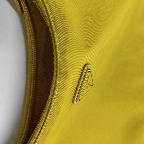 Authenticated pre-owned Re-Edition2000 Mini Nylon Yellow - Top Handle Bag at Looply