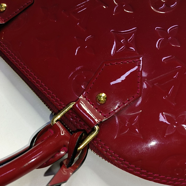 Authenticated pre-owned Alma PM Monogram Calfskin Red - Top Handle Bag at Looply
