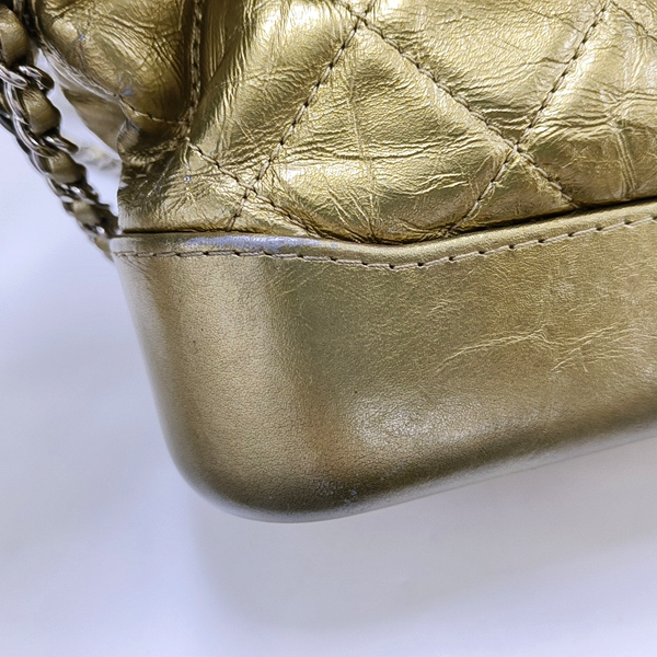 Authenticated pre-owned Gabrielle Small Quilted Calfskin Gold - Crossbody Bag at Looply
