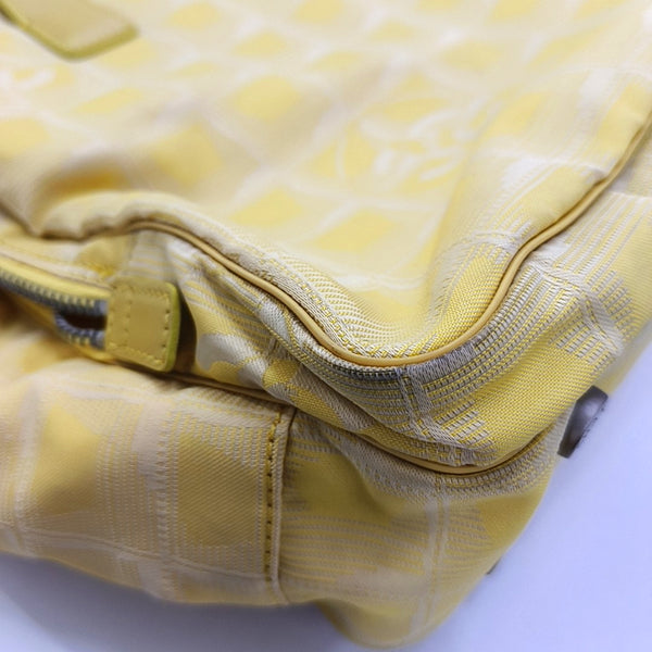 Authenticated pre-owned Chanel Travel Line Fabric Yellow - Shoulder Bag at Looply