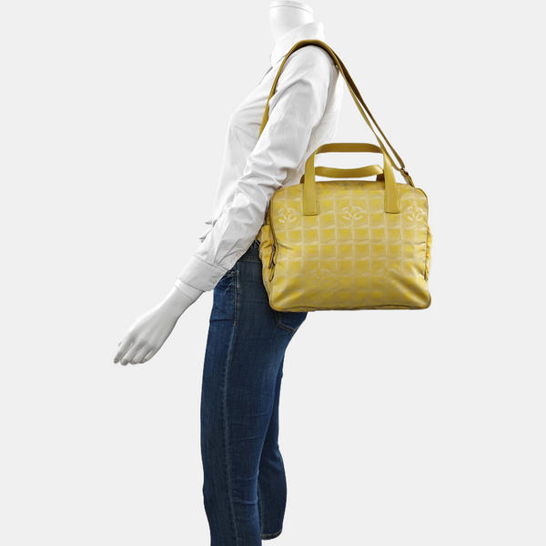 Authenticated pre-owned Chanel Travel Line Fabric Yellow - Shoulder Bag at Looply