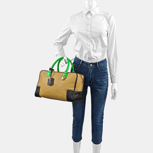 Authenticated pre-owned Amazona Calfskin Yellow - Top Handle Bag at Looply
