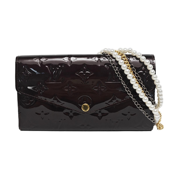 Authenticated pre-owned LV × TM Sarah Patent Leather Burgundy - Clutch at Looply