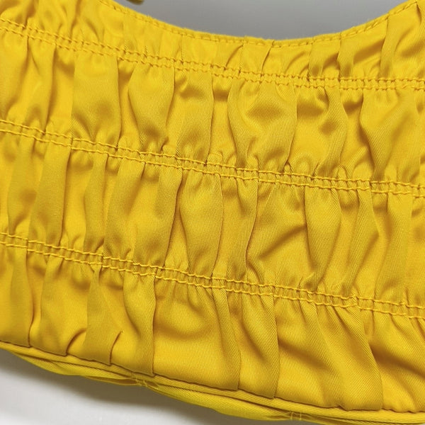 Authenticated pre-owned Re-edition2005 Mini Nylon Yellow - Top Handle Bag at Looply
