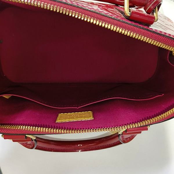 Authenticated pre-owned Alma PM Monogram Calfskin Red - Top Handle Bag at Looply
