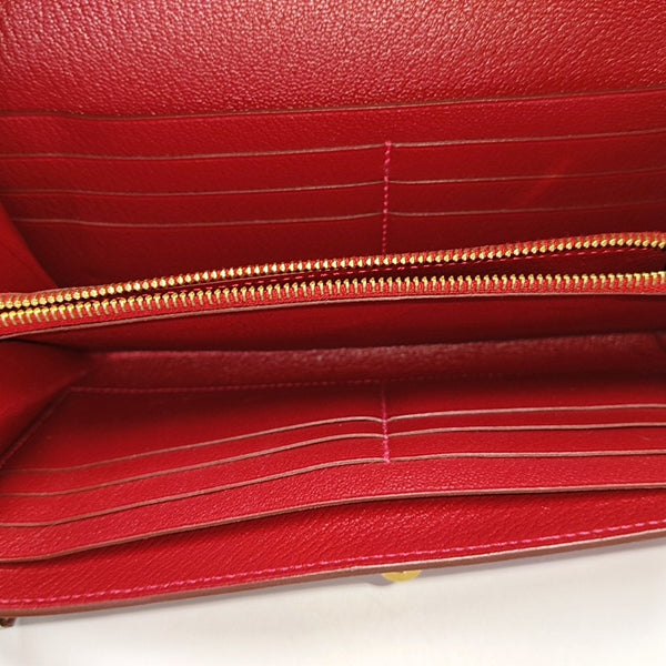 Authenticated pre-owned Kelly Ostrich Red Wallet - Wallet at Looply