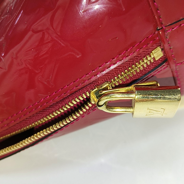 Authenticated pre-owned Alma PM Monogram Calfskin Red - Top Handle Bag at Looply