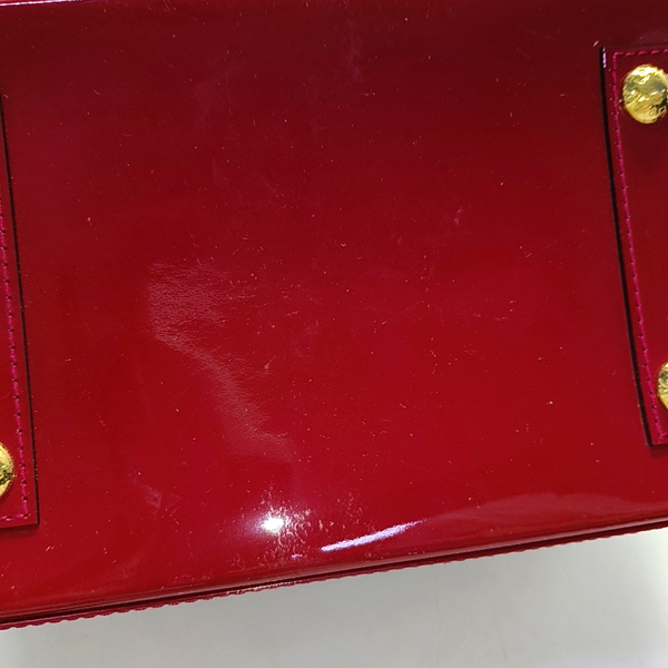 Authenticated pre-owned Alma PM Monogram Calfskin Red - Top Handle Bag at Looply
