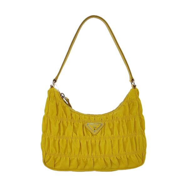 Authenticated pre-owned Re-edition2005 Mini Nylon Yellow - Top Handle Bag at Looply