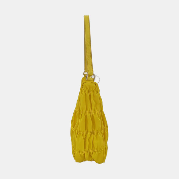 Authenticated pre-owned Re-edition2005 Mini Nylon Yellow - Top Handle Bag at Looply