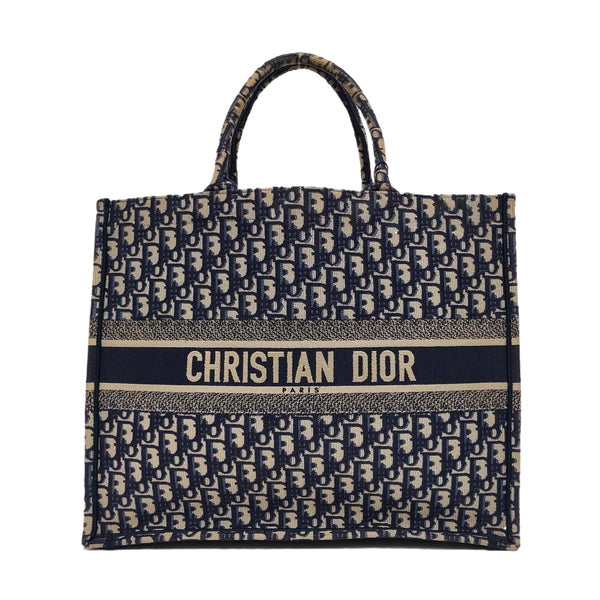 Authenticated pre-owned Book Tote Large Monogram Canvas Blue - Top Handle Bag at Looply