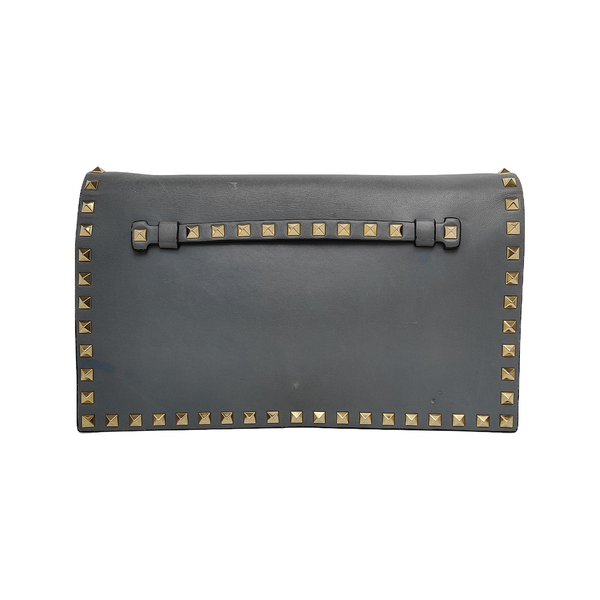 Authenticated pre-owned  Rockstud Calfskin Blue - Clutch at Looply