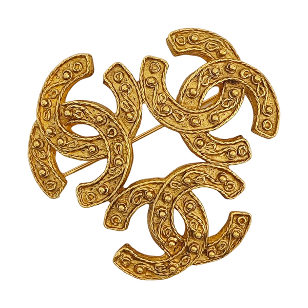 Broche de oro de metal
