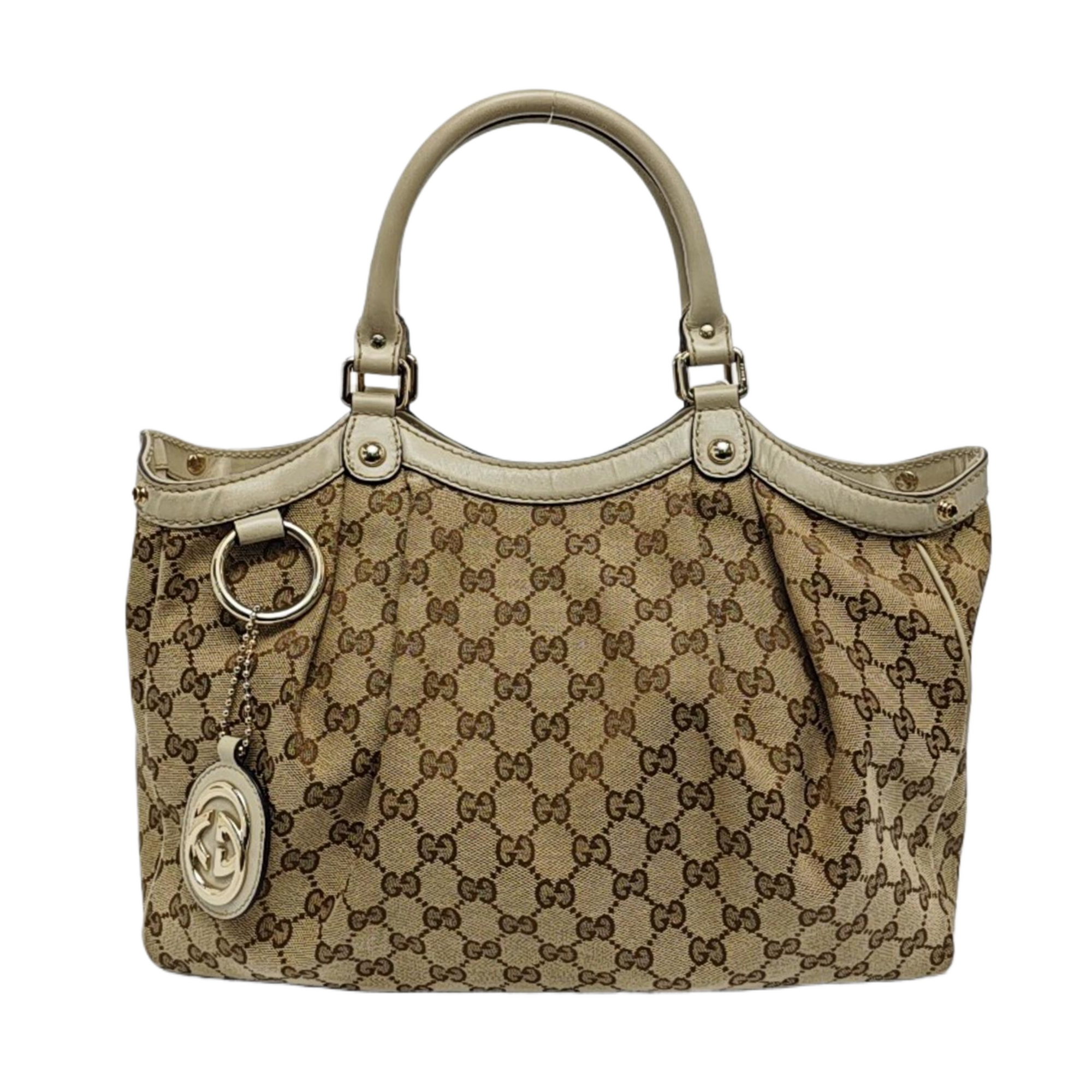 Authenticated pre-owned  Sukey Monogram Canvas Beige - Top Handle Bag at Looply