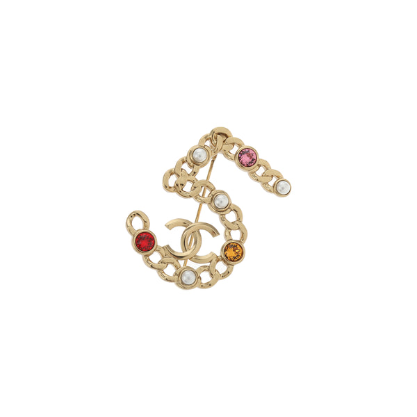 Broche de oro de metal