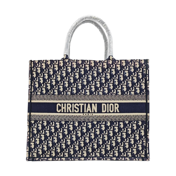 Authenticated pre-owned  Book Tote Large Monogram Canvas Beige - Tote Bag at Looply