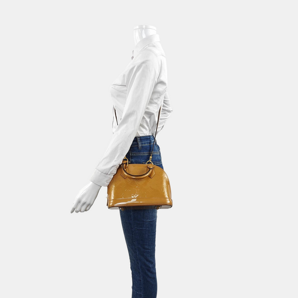 Authenticated pre-owned  ALMA Monogram Patent Leather Yellow - Shoulder Bag at Looply