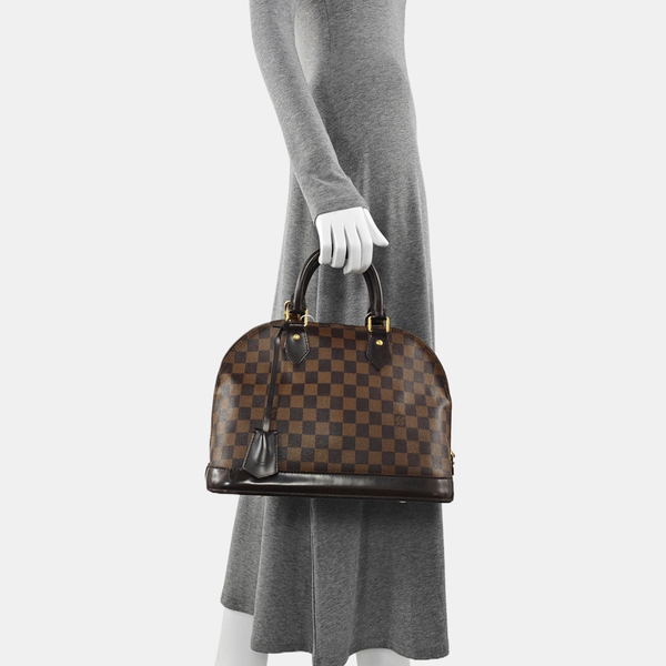 Authenticated pre-owned  ALMA PM Damier Ebene Coated Canvas Brown - Top Handle Bag at Looply