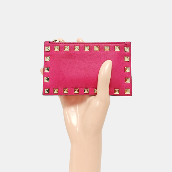 Authenticated pre-owned  Rockstud Calfskin Pink - Clutch at Looply
