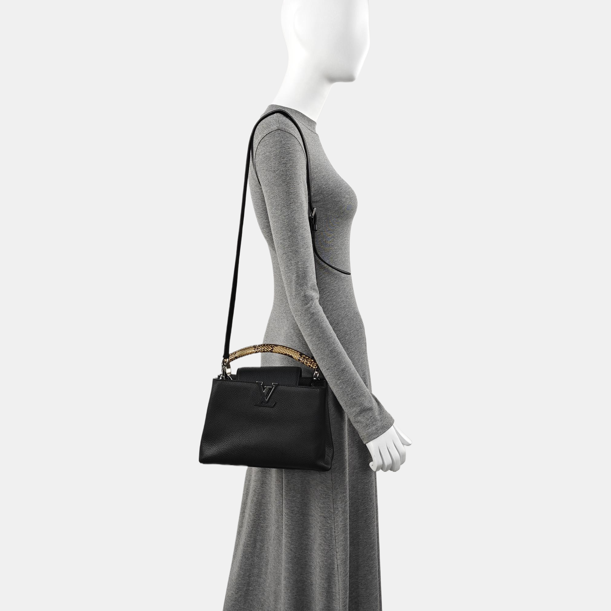Authenticated pre-owned  CAPUCINES Calfskin Black - Top Handle Bag at Looply