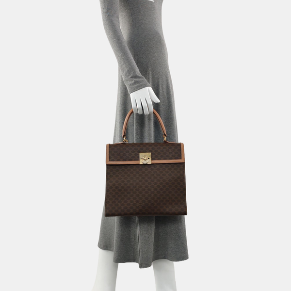 Authenticated pre-owned  MACADAM BLASON TRIOMPHE Coated Canvas Brown - Top Handle Bag at Looply