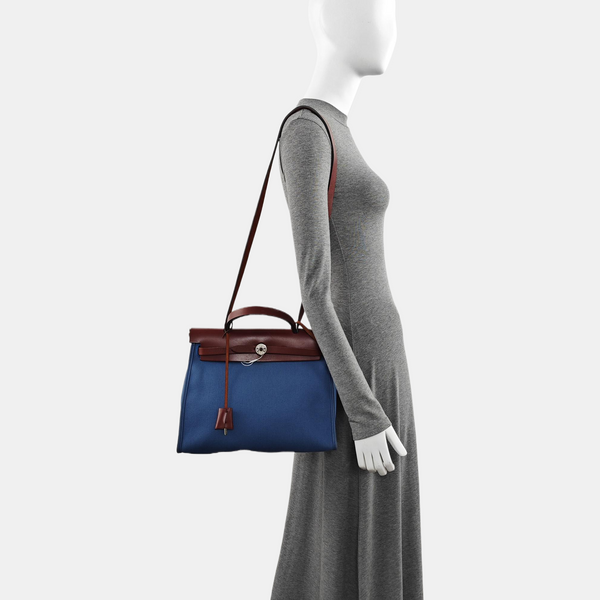 Authenticated pre-owned  Herbag 31 Canvas Blue - Shoulder Bag at Looply