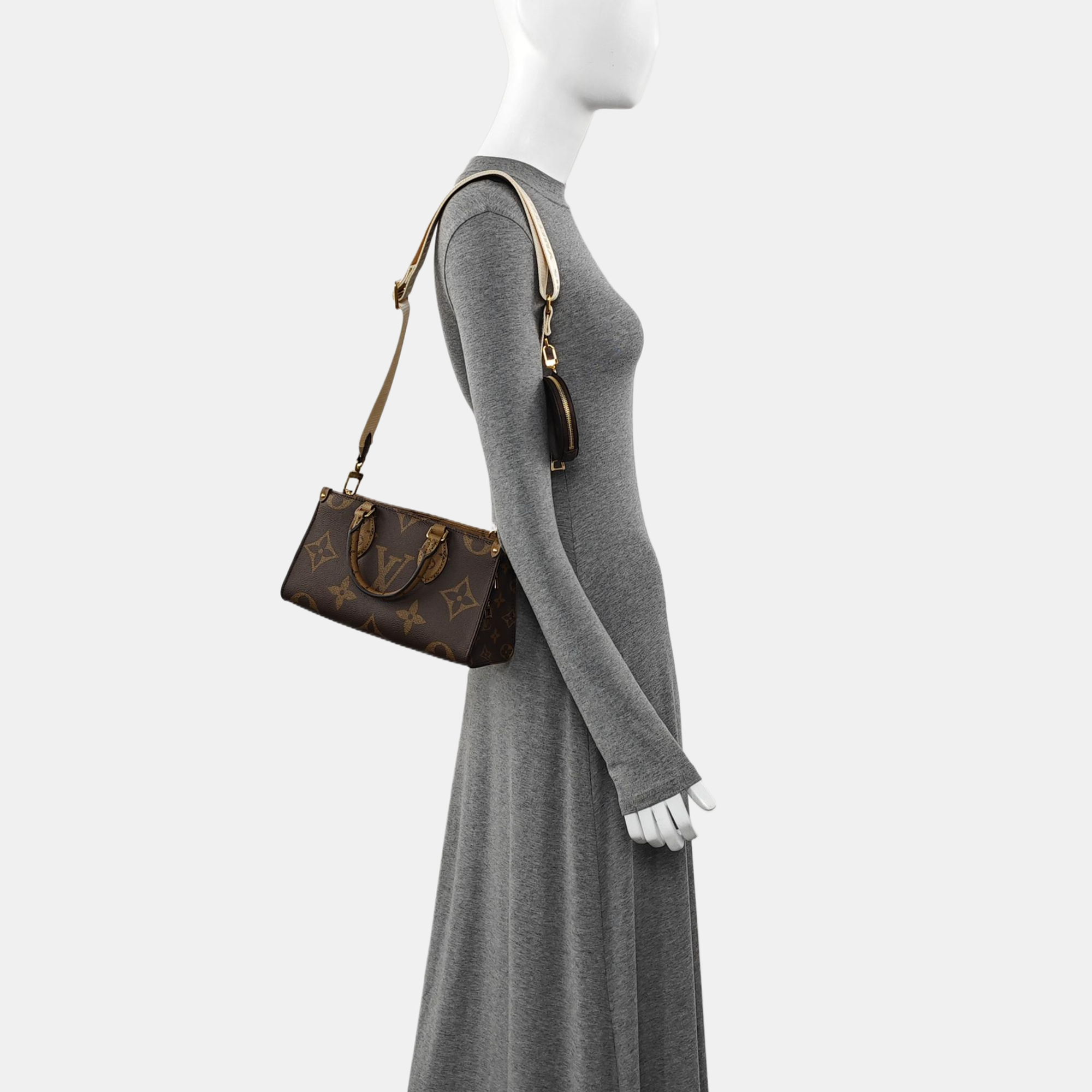 ONTHEGO EAST WEST PM Monogram Coated Canvas Brown