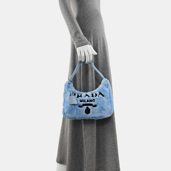 Authenticated pre-owned  Re-Edition2000 Mini Terry Cloth Blue - Top Handle Bag at Looply