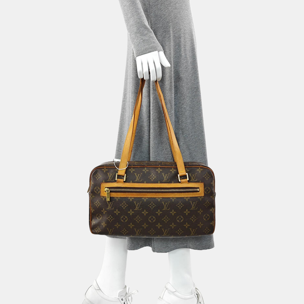 CITE GM Monogram Coated Canvas Brown