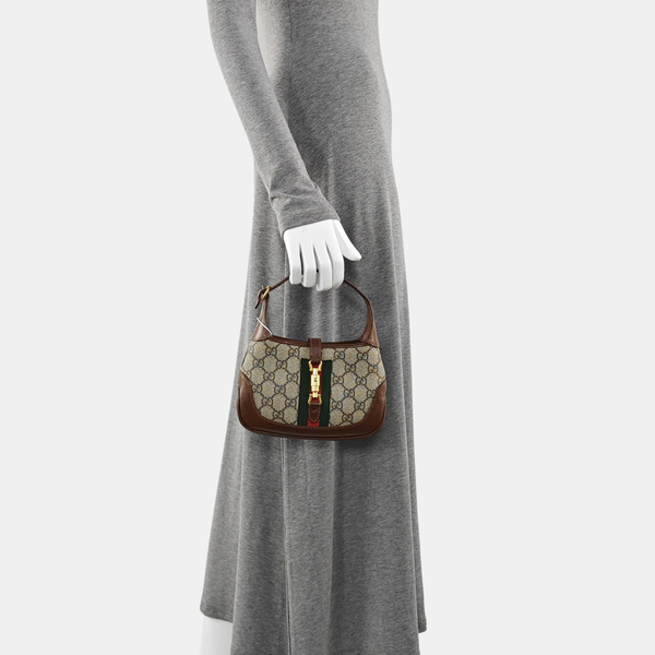 Authenticated pre-owned  Jackie 1961 Mini Monogram Coated Canvas Beige - Top Handle Bag at Looply