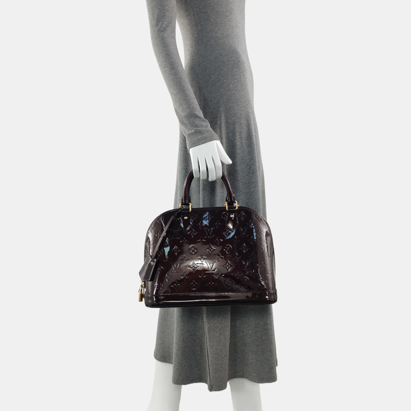 Authenticated pre-owned  ALMA PM Monogram Patent Leather Burgundy - Top Handle Bag at Looply