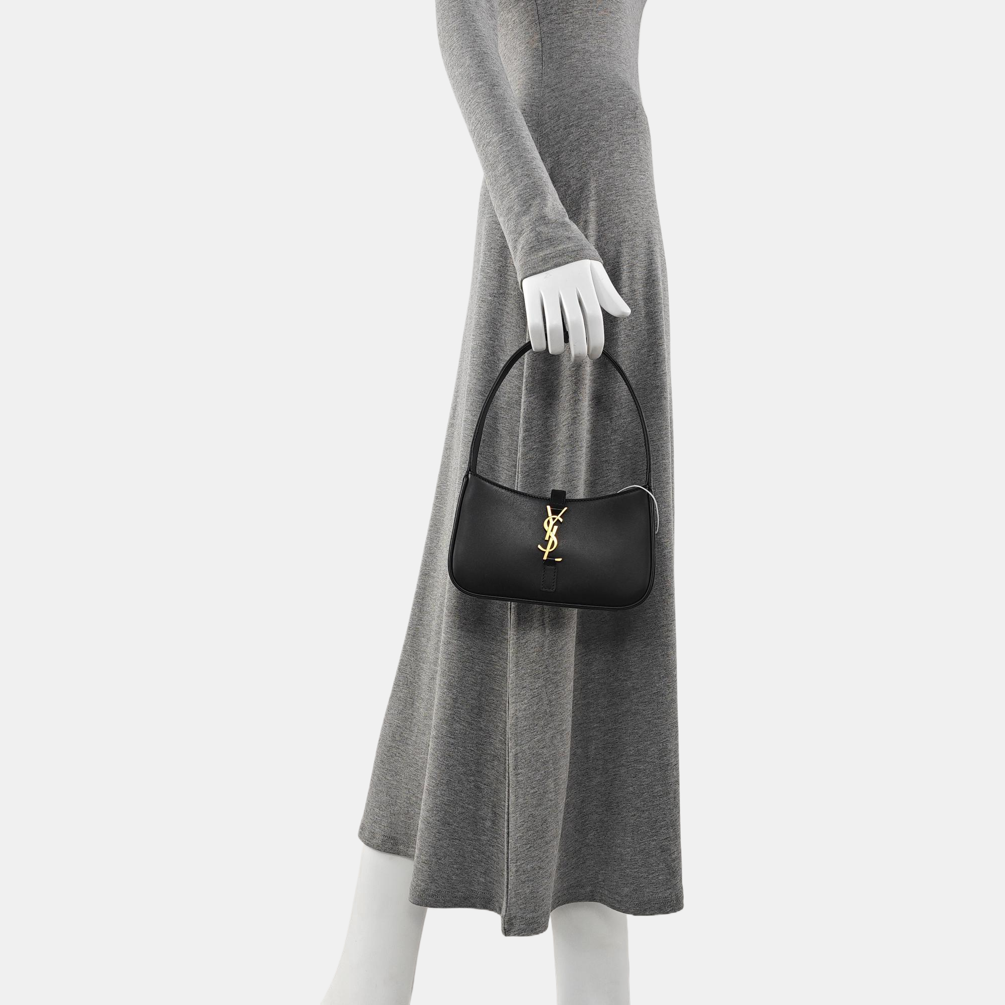 Authenticated pre-owned  LE 5 À 7 Calfskin Black - Top Handle Bag at Looply