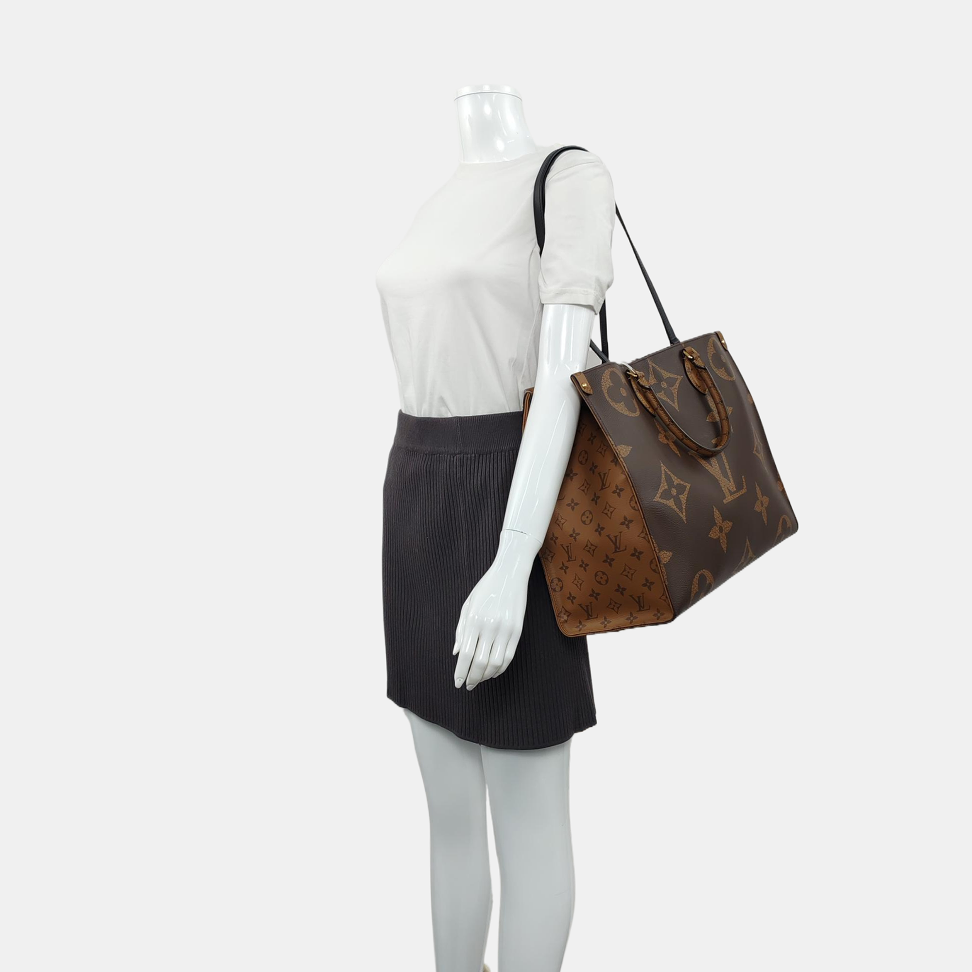 Authenticated pre-owned  ONTHEGO GM Monogram Coated Canvas Brown - Tote Bag at Looply