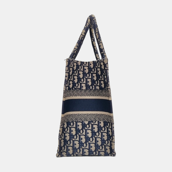 Authenticated pre-owned  Book Tote Medium Monogram Canvas Blue - Tote Bag at Looply