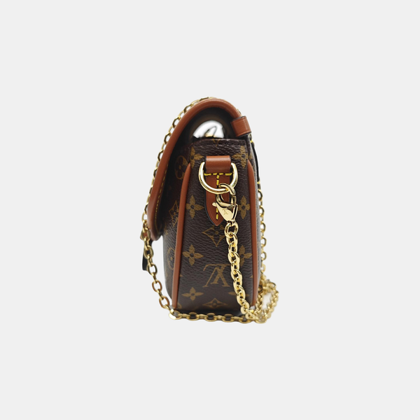 SAUMUR Monogram Coated Canvas Brown